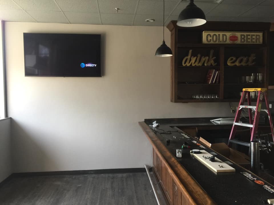 Restaurant wall-mounted television installation by J&S Audio Video Solutions