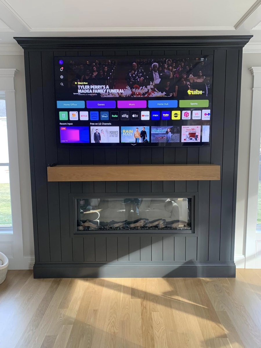 Custom built-in TV over a linear fireplace installed by J&S Audio Video Solutions in a Central Massachusetts home