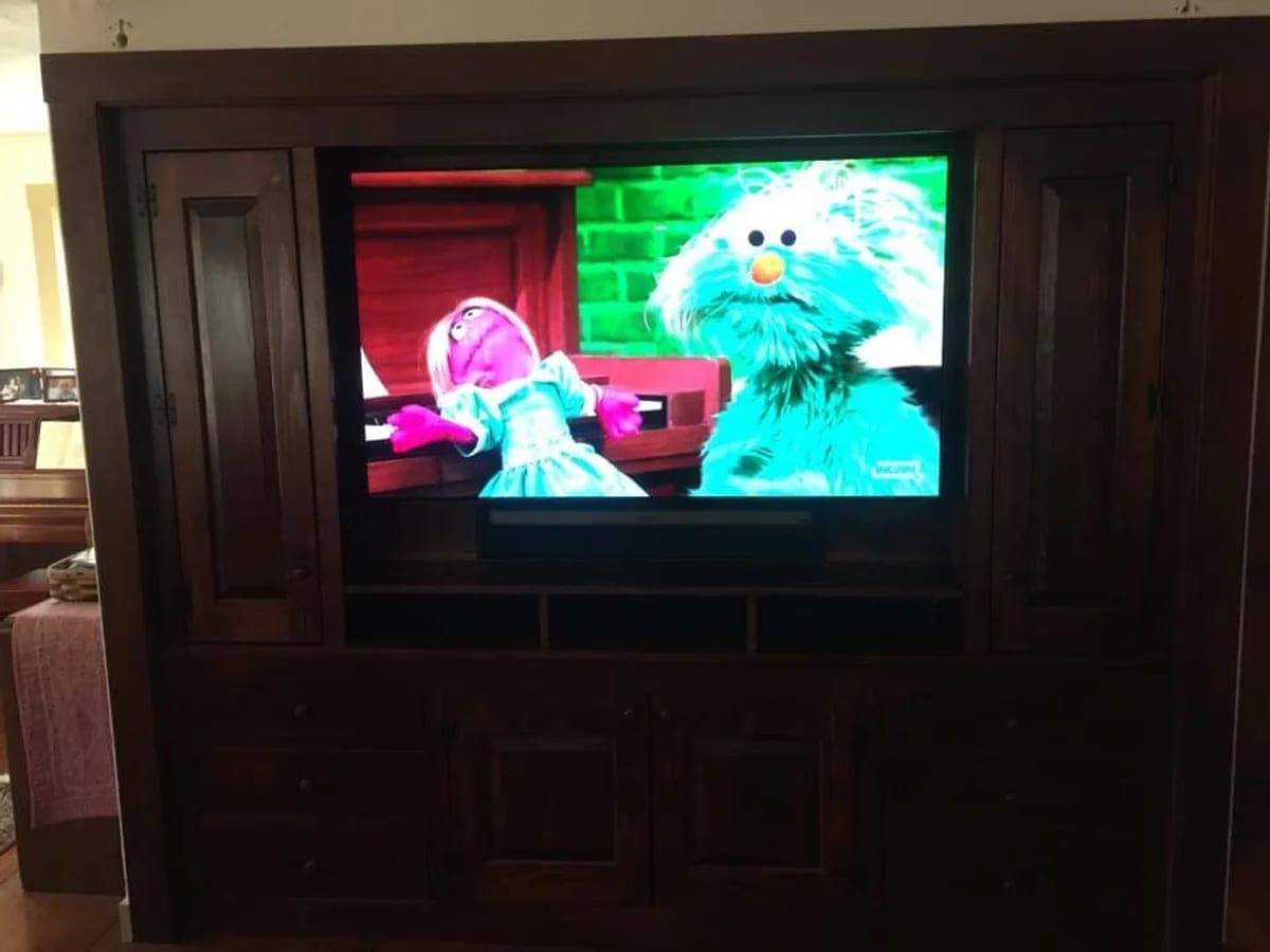 Home television setup integrated into cabinetry in the Webster area by J&S Audio Video Solutions