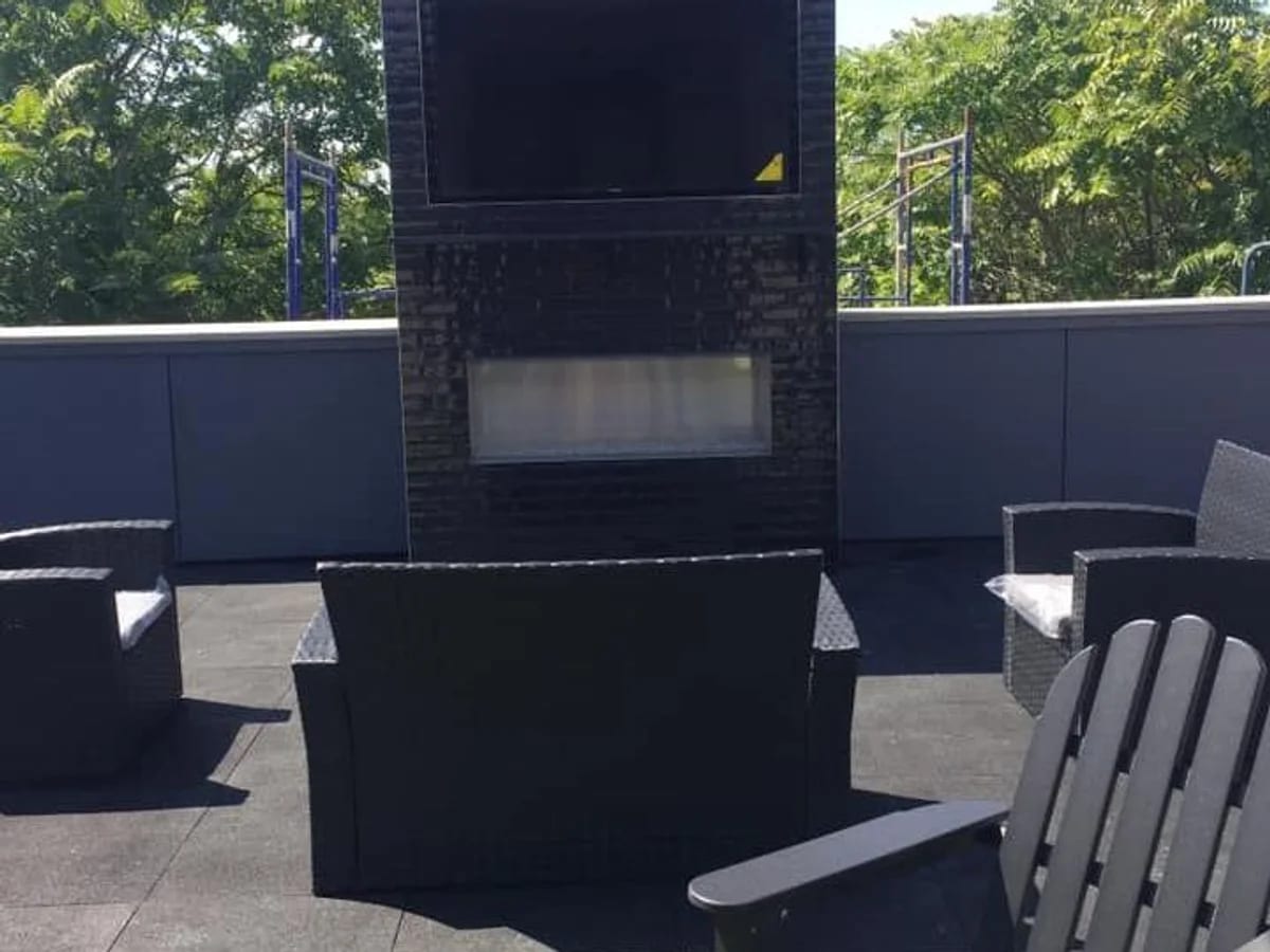 Outdoor fireplace entertainment setup in the Brookfield area by J&S Audio Video Solutions