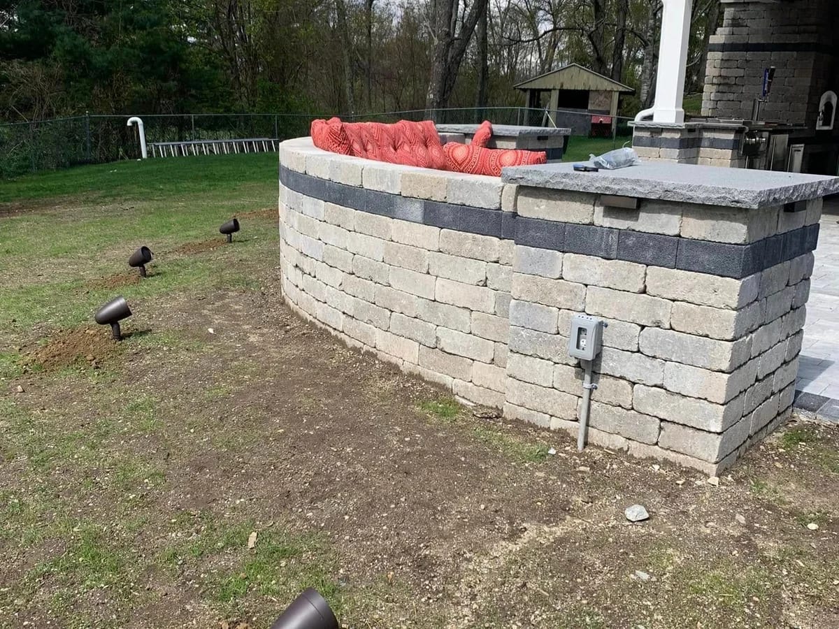 Outdoor landscape lighting installation in the Sturbridge area by J&S Audio Video Solutions
