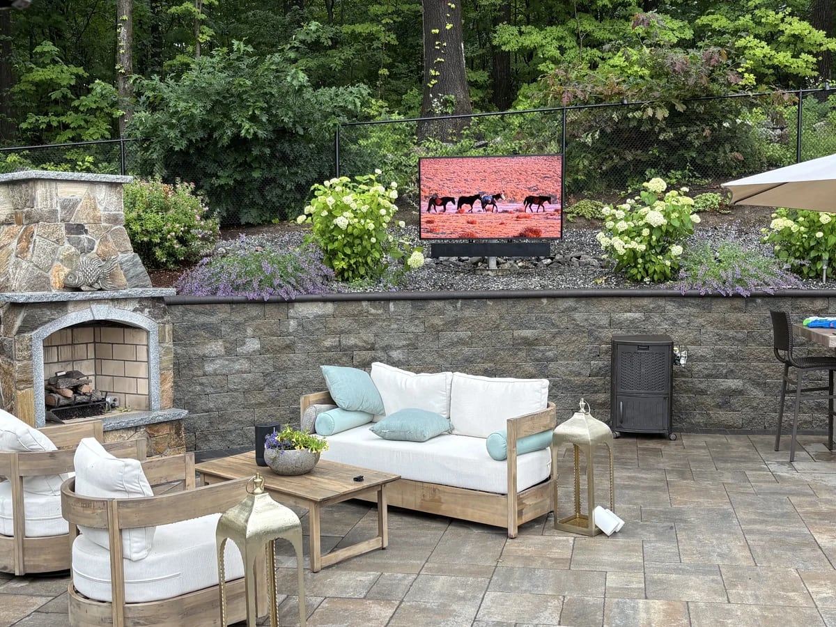 Outdoor patio television and sound system on a stone patio in Leicester, MA by J&S Audio Video Solutions