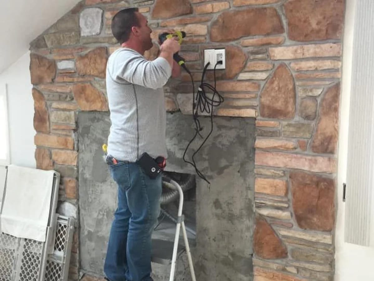 Residential AV installation on a stone wall in the Brookfield area by J&S Audio Video Solutions