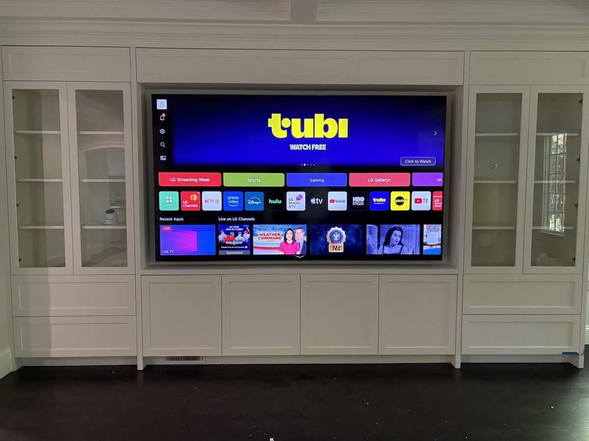 Television installed in built-in cabinetry in a Westborough, MA living room